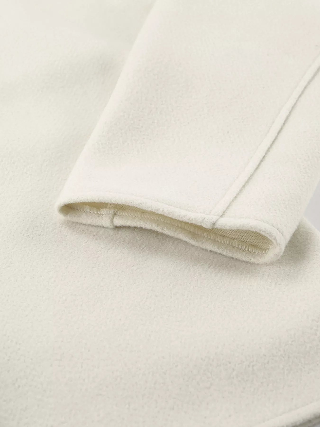 Close-up of the sleeve of Open Front Dropped Shoulder Outerwear for Women, showcasing soft fabric texture.