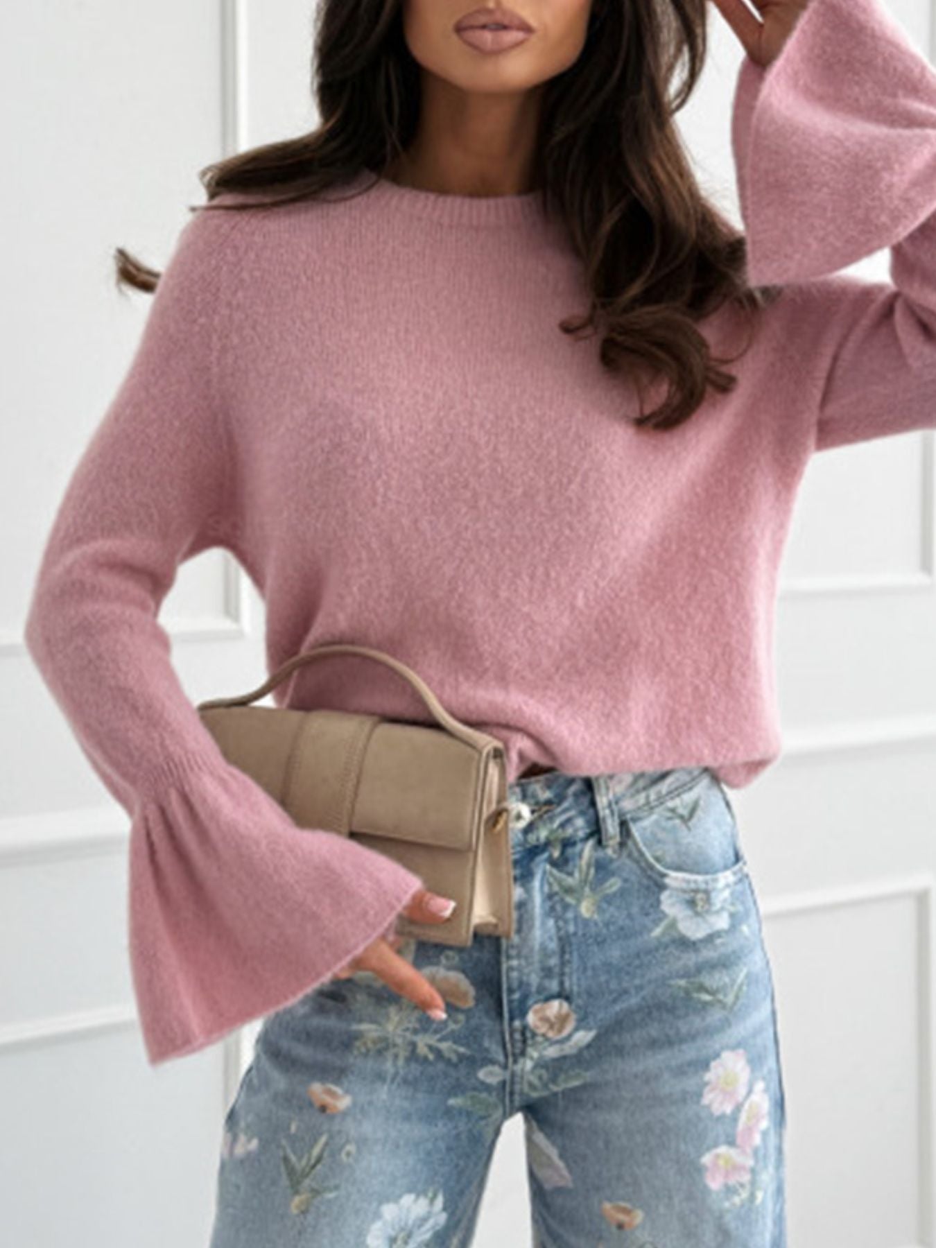 Round Neck Flounce Sleeve Sweater in soft pink, featuring flounce sleeves, paired with floral jeans.