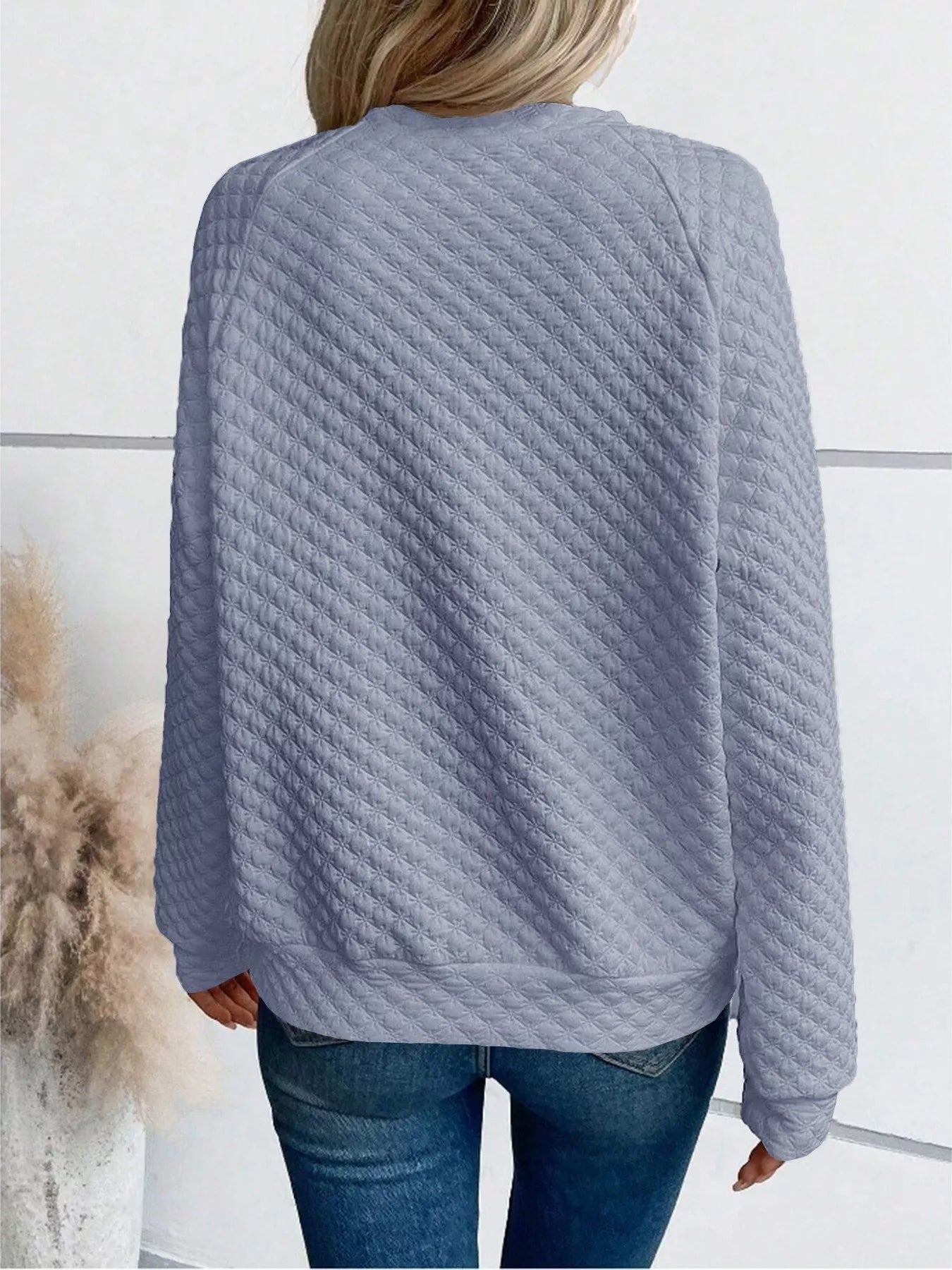 Back view of Quilted Texture Long Sleeve Sweatshirt with Notched Neck, showcasing its textured design and relaxed fit.