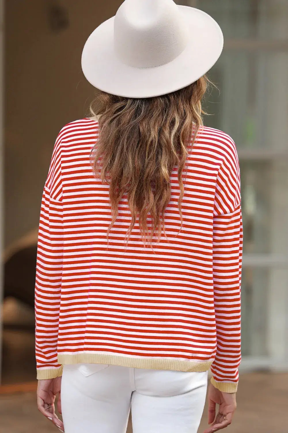 Woman wearing a Striped Round Neck Drop Shoulder T-Shirt in red and white, styled with a wide-brim hat.
