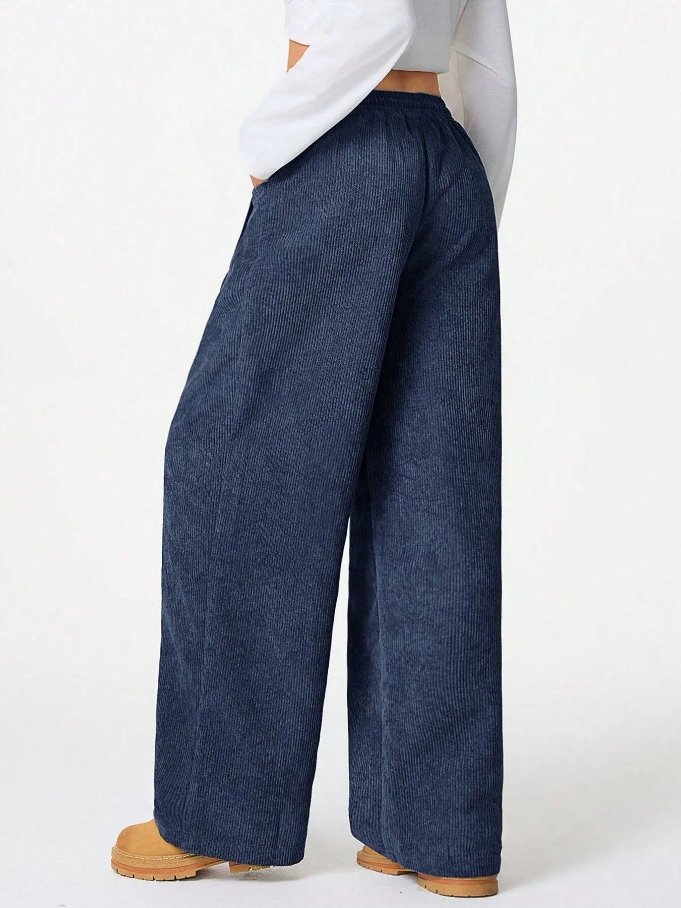 Back view of Drawstring Wide Leg Pants showcasing relaxed fit and denim texture for everyday comfort.