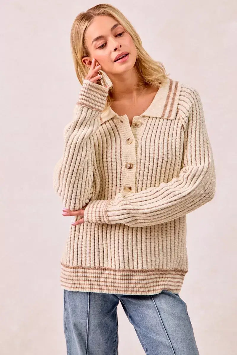 BiBi half button ribbed two tone sweater in a light beige color, styled with casual jeans.