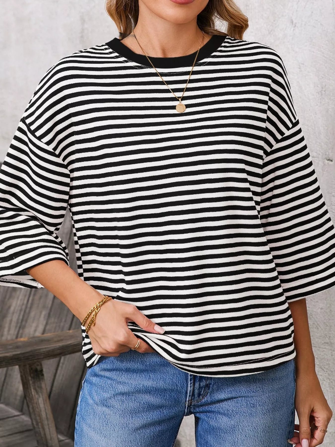 Striped Back Bow Tie T-Shirt featuring oversized design and casual style with black and white stripes.