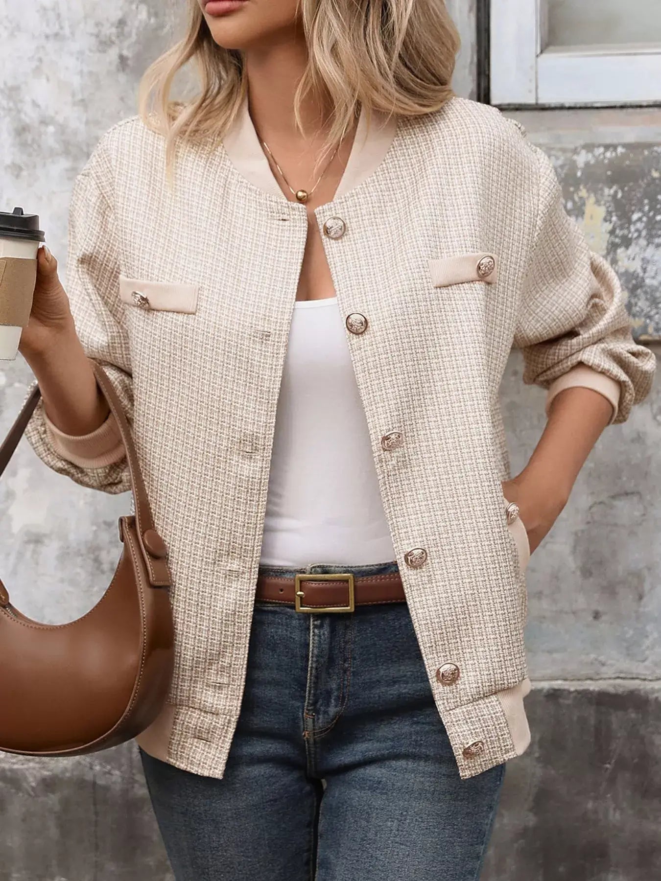 Woman wearing a Button Up Long Sleeve Jacket with pockets, stylishly holding a coffee cup.