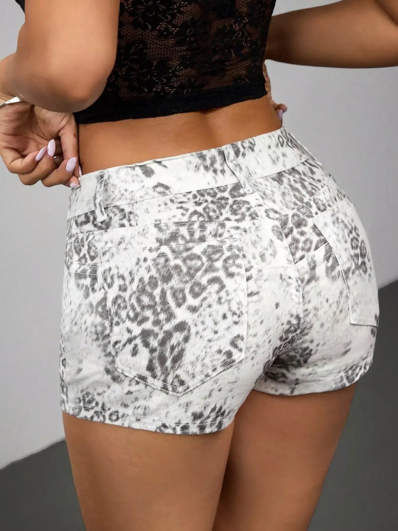 Leopard print denim shorts for women, showcasing a flattering fit and trendy design, perfect for casual summer outfits.