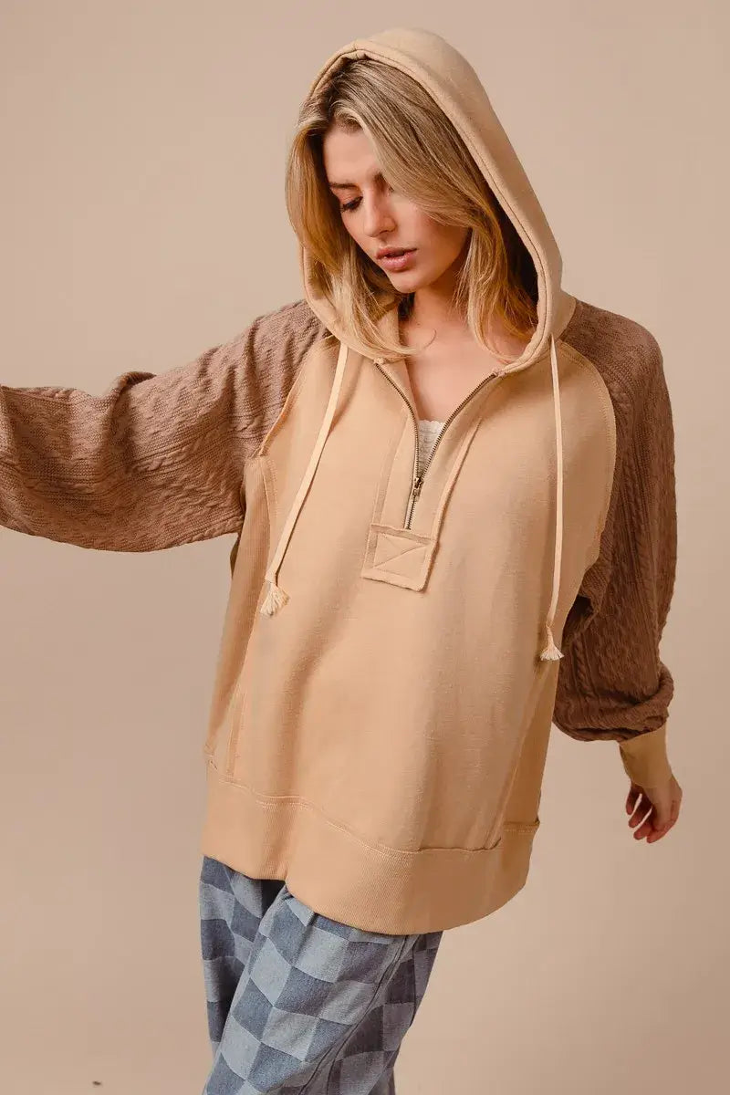 BiBi Half Zip French Terry Hoodie with Knit Sleeves worn by a model, showcasing its stylish design and comfort.