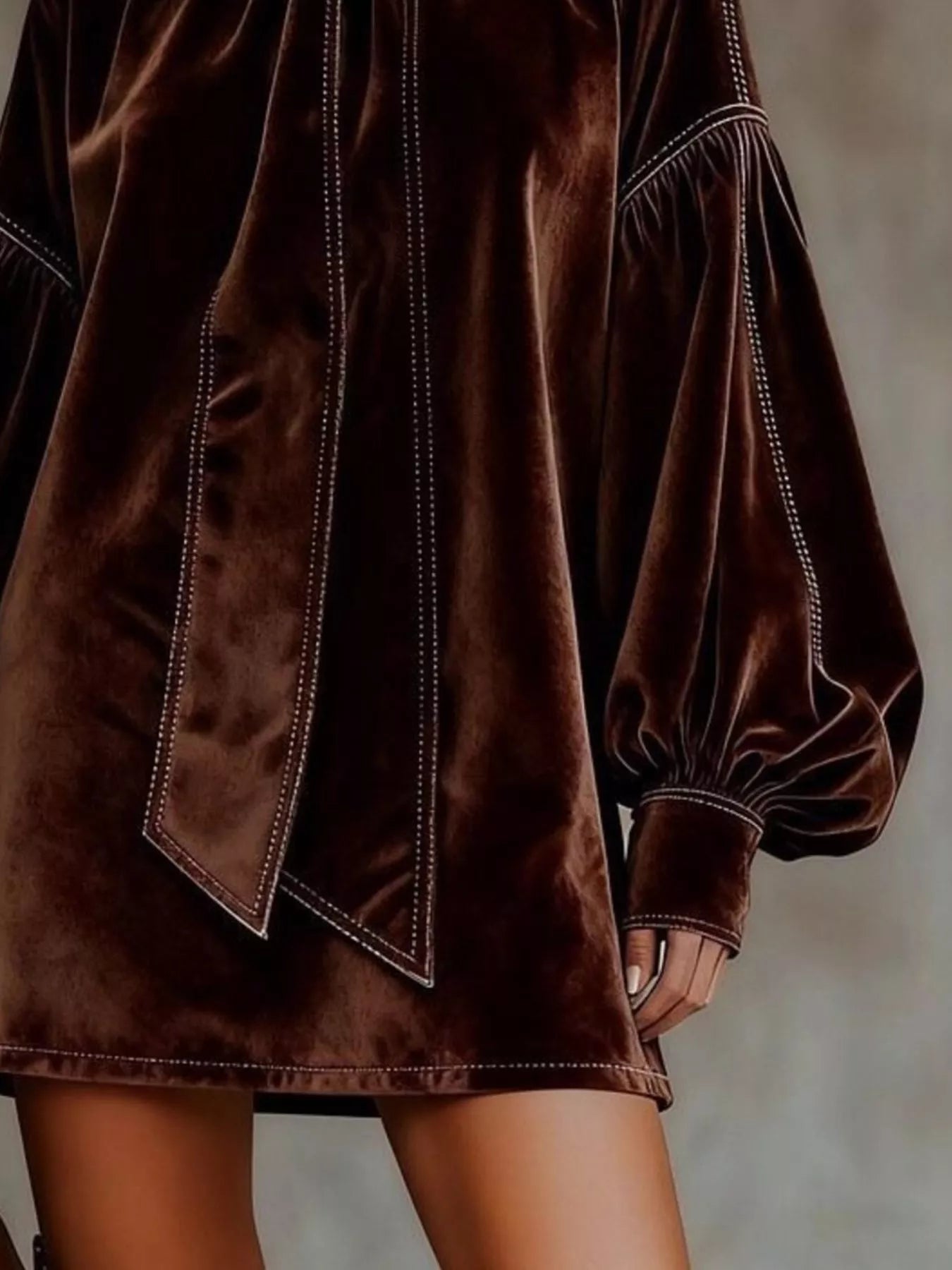 Velvet Bow Tie Long Sleeve Mini Dress in rich brown color, featuring puff sleeves and elegant bow detail.