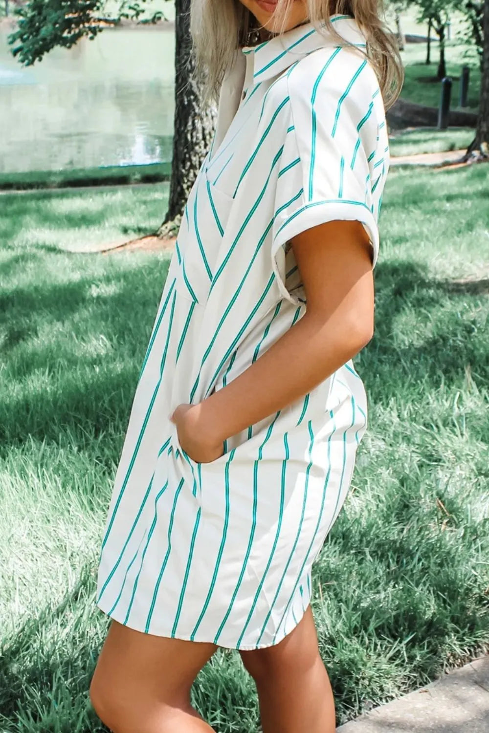 Model wearing a St Patricks Striped Wide Short Sleeve Shift Mini Shirt Dress with pockets outdoors.