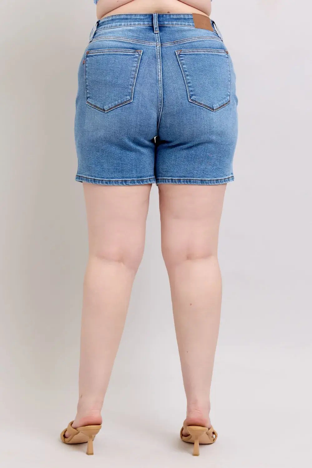 Back view of Judy Blue Plus Size Denim Shorts with 2 buttons and pockets, showcasing a comfortable fit and classic style.
