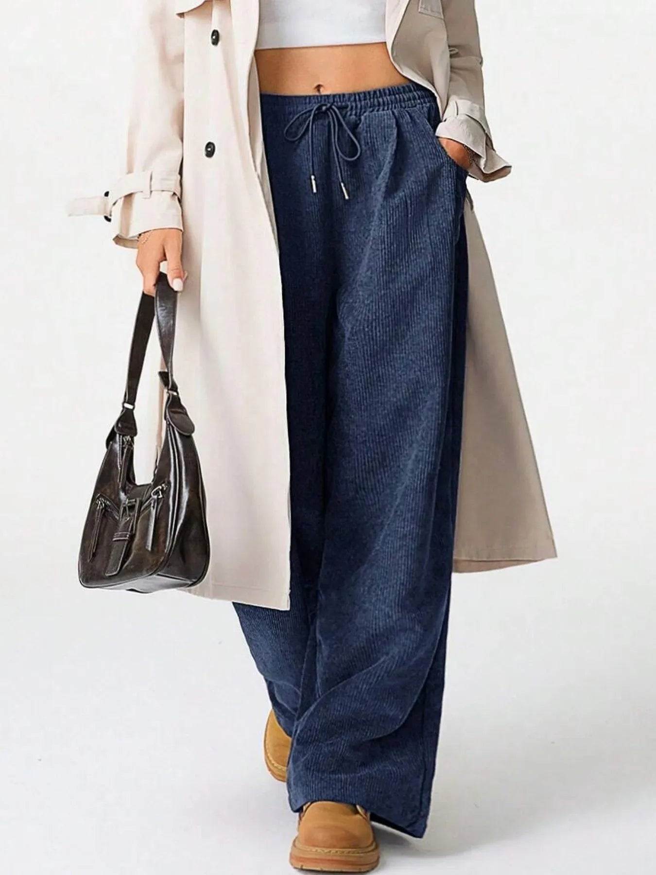 Model wearing Drawstring Wide Leg Pants paired with a trench coat, showcasing relaxed everyday comfort and style.