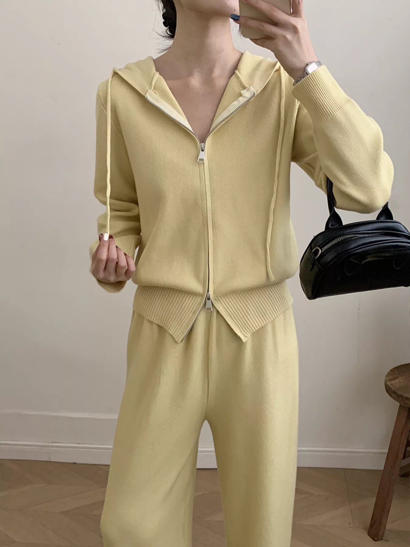 Zip Up Cardigan and Wide Leg Pants Knit Set worn by a woman, featuring a yellow zipper hoodie and matching pants.