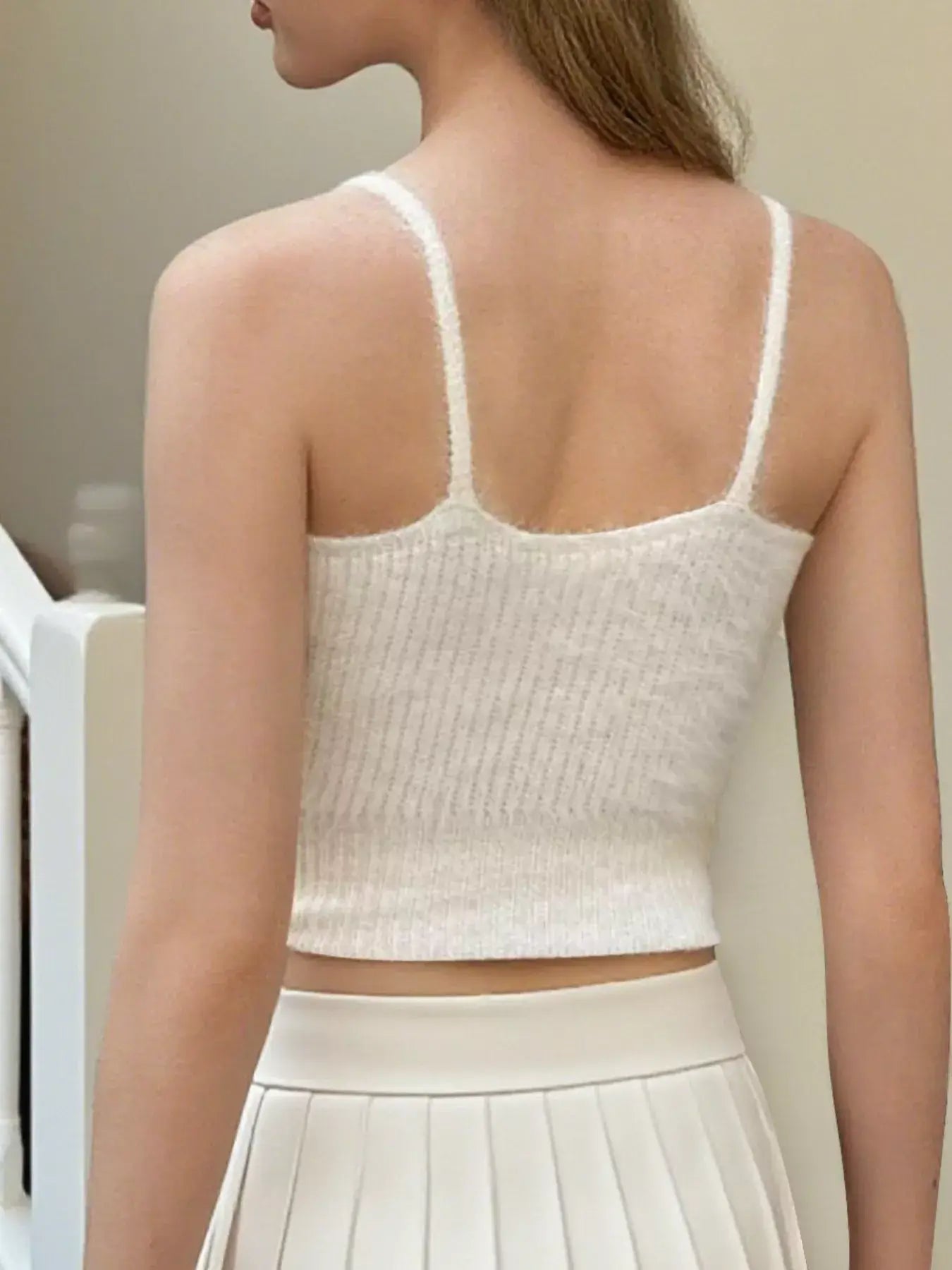 Back view of the Bow Scoop Neck Cropped Cami showcasing its ribbed texture and cute design, perfect for summer layering.