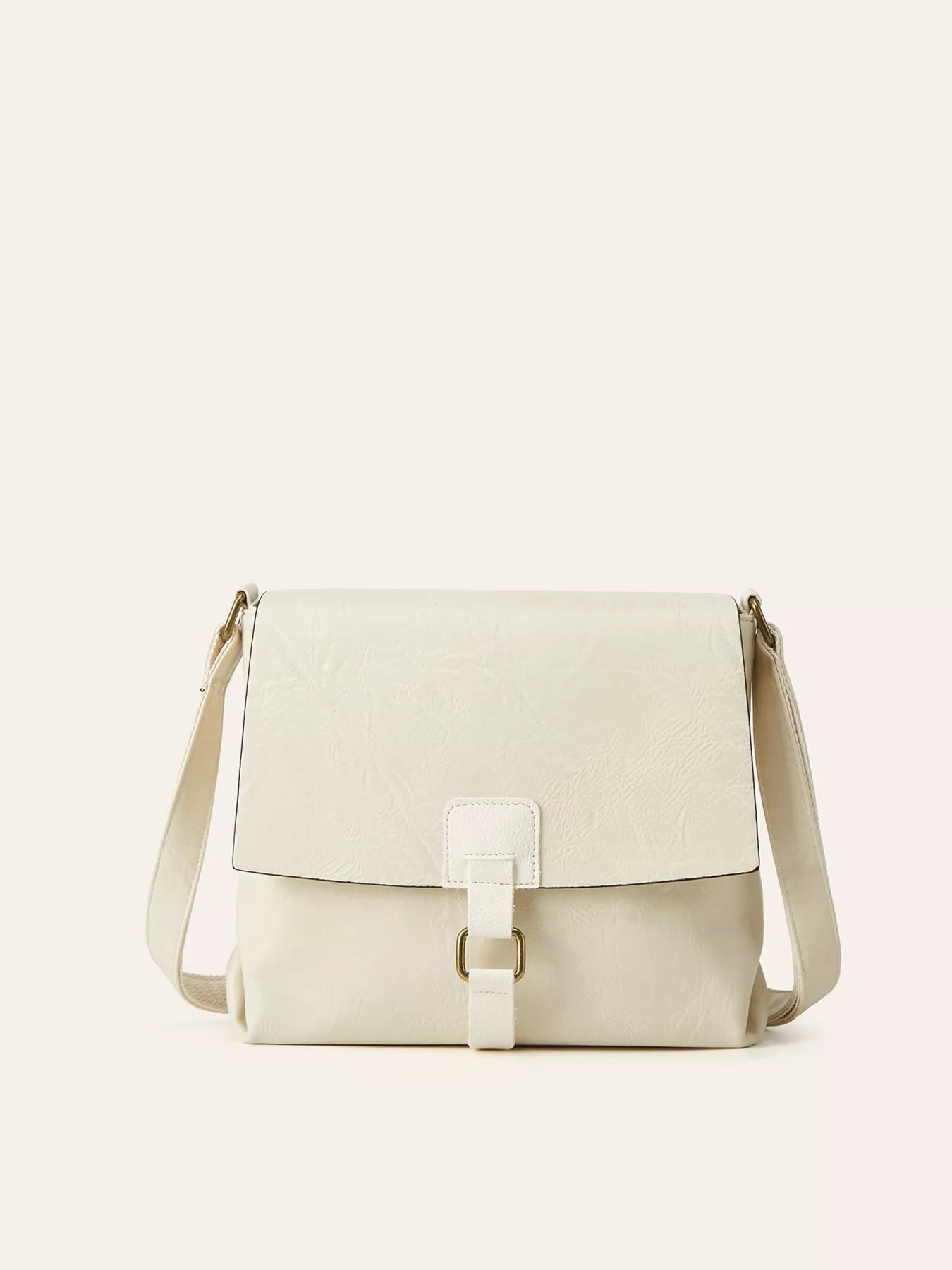 Vintage Buckle Flap Crossbody Bag in cream PU leather with adjustable strap and buckle closure.