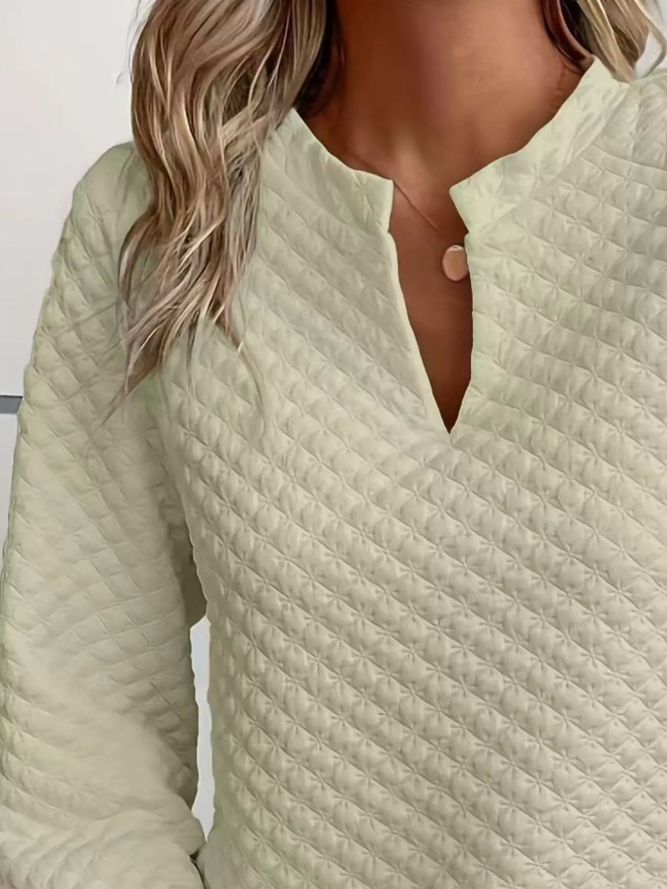 Quilted Texture Long Sleeve Sweatshirt with Notched Neck, featuring a light green hue and quilted design.