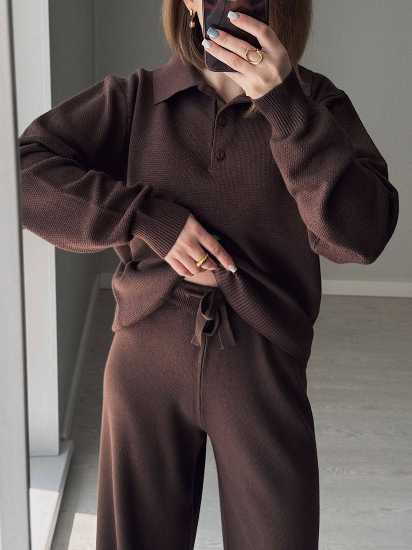 Model wearing Polo Collar Knit Two Piece Set in brown, featuring a buttoned top and tied pants.