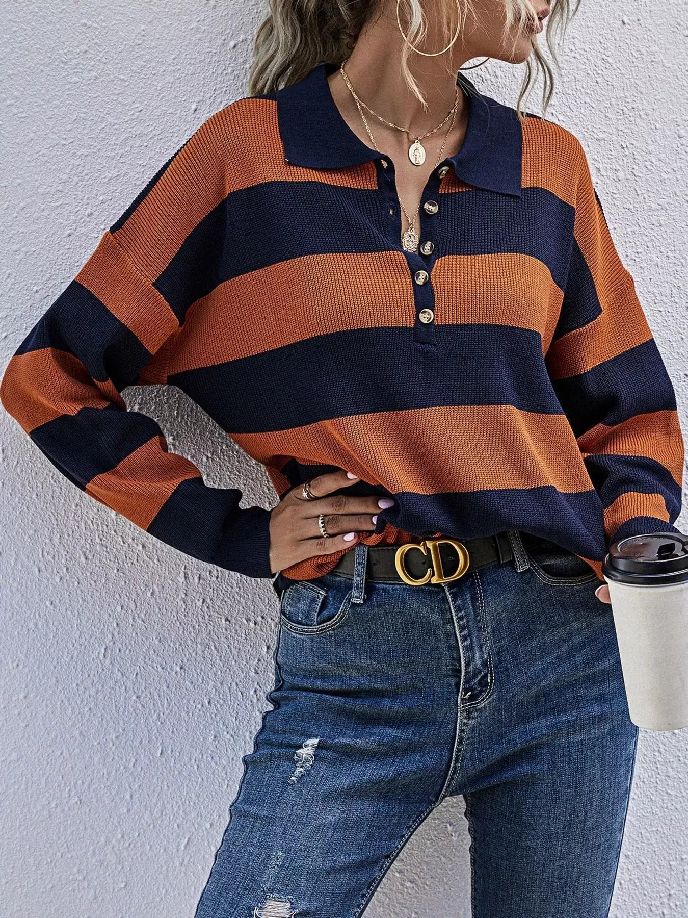 Striped Button Detail Dropped Shoulder Knit Top in orange and navy stripes with a relaxed fit.