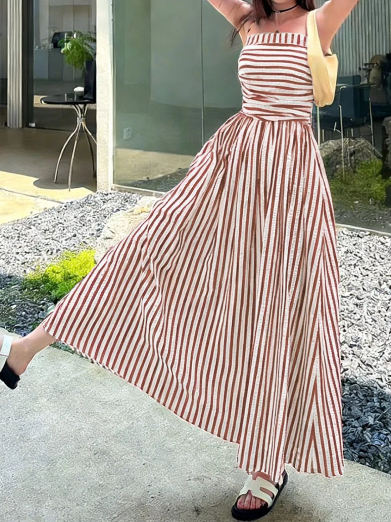 Striped Spaghetti Strap Casual Maxi Dress for Summer Wear with a flowing skirt and pockets, perfect for outdoor outings.