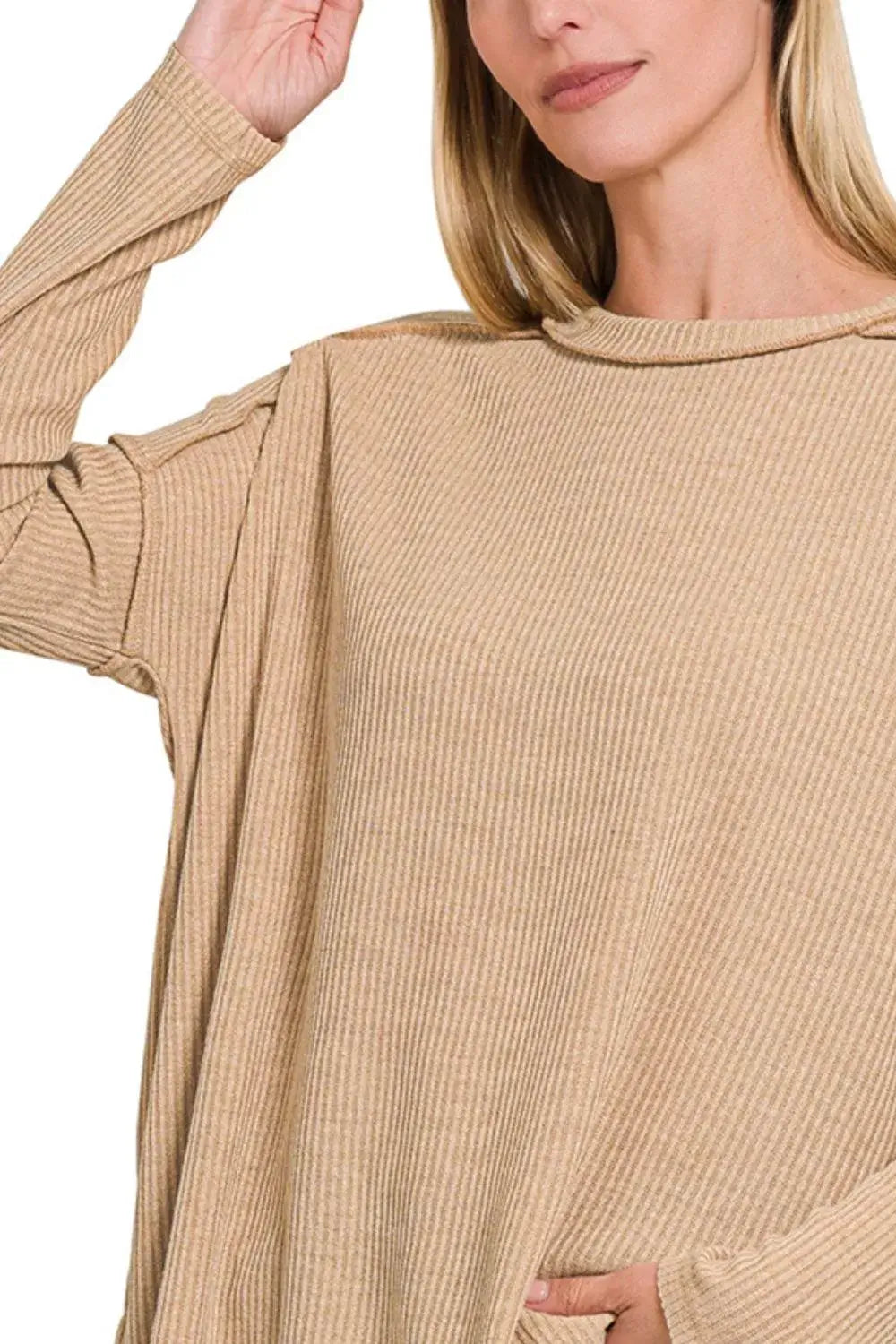 Model wearing Zenana Ribbed Drop Shoulder Round Neck Sweater, showcasing its soft ribbed texture and relaxed fit.