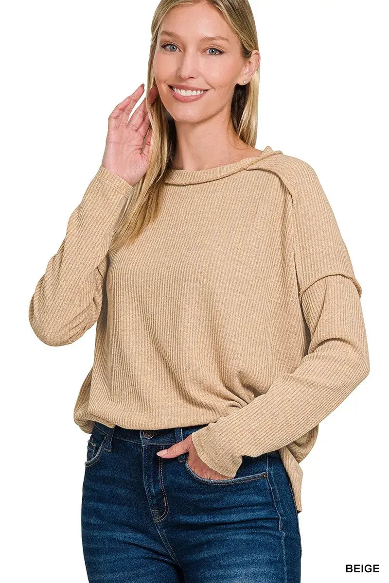 Zenana Ribbed Drop Shoulder Round Neck Sweater in beige worn by a smiling woman, perfect for effortless chic styling.