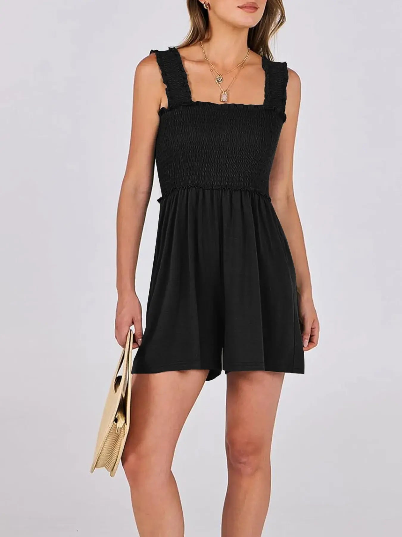Model wearing a Smocked Square Neck Summer Romper in black, showcasing its stylish design and comfortable fit.