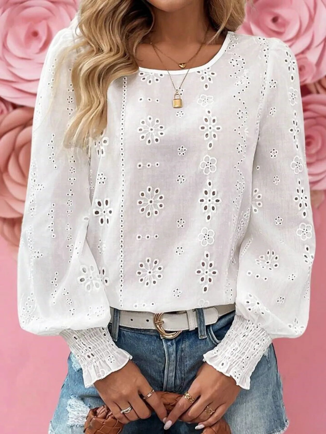 Eyelet Long Sleeve Blouse with Elastic Cuffs for Women, featuring intricate designs and elastic cuffs, styled with denim shorts.