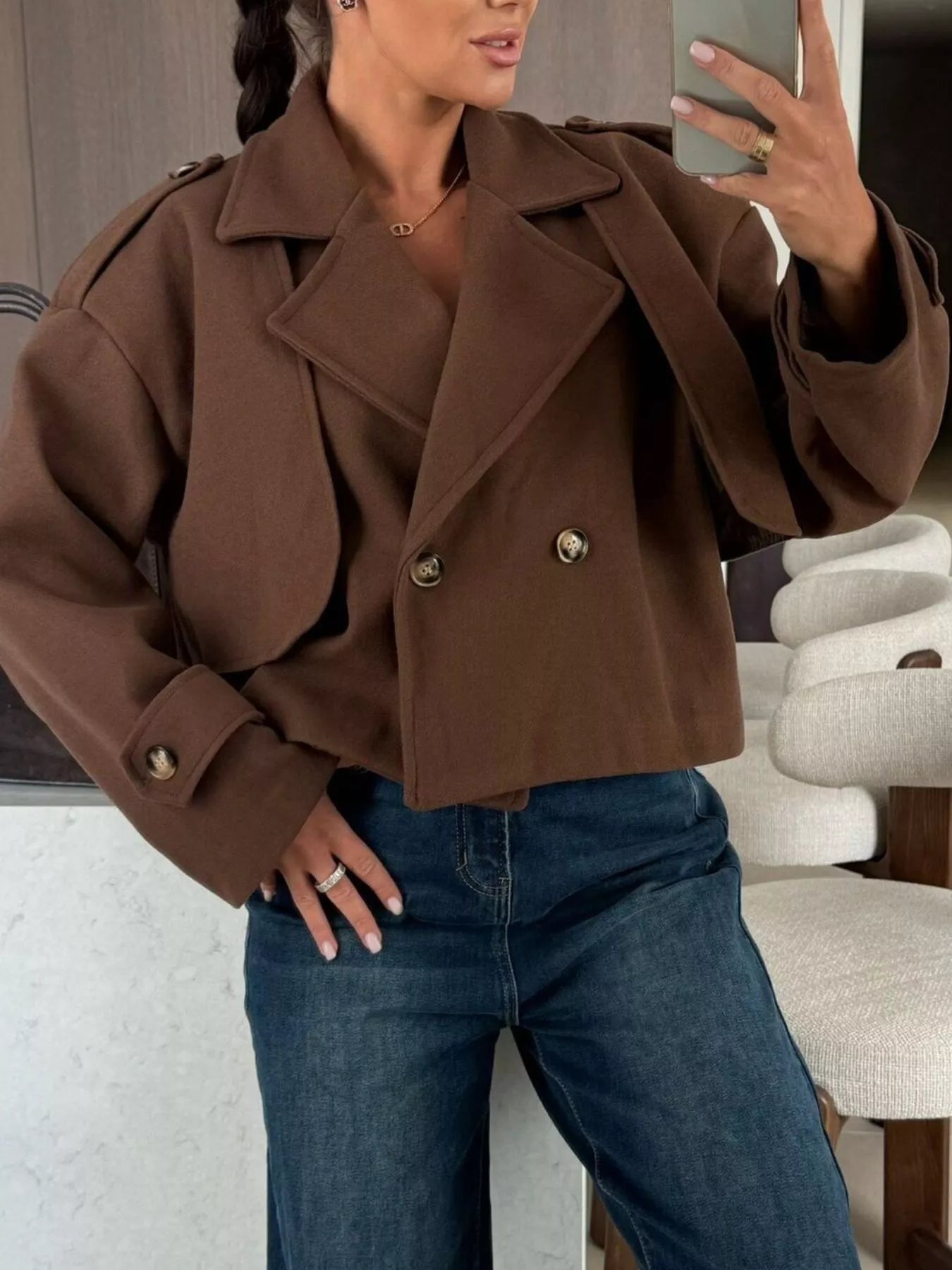 Model wearing Double-Breasted Cropped Outerwear in brown, styled with relaxed jeans for a modern layered look.