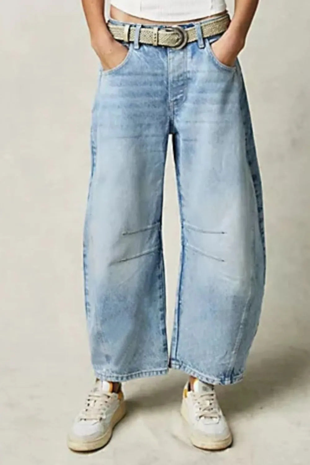 Wide Leg Jeans with Pockets in light blue, featuring a buttoned front and pocket design for casual style.