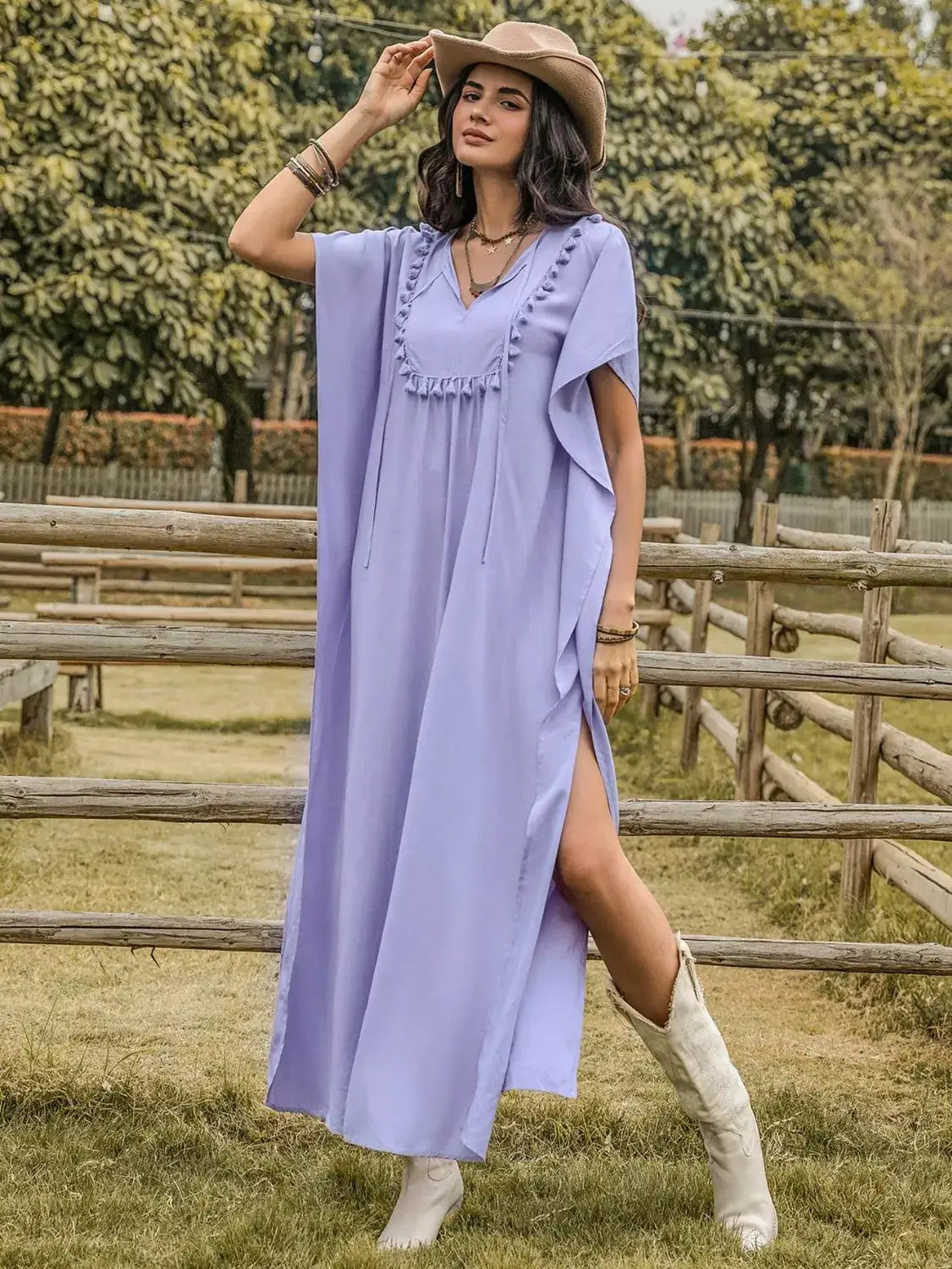 Side Slit Tie Neck Flutter Sleeve Dress worn by model outdoors, showcasing stylish design and flowing silhouette in light lavender.
