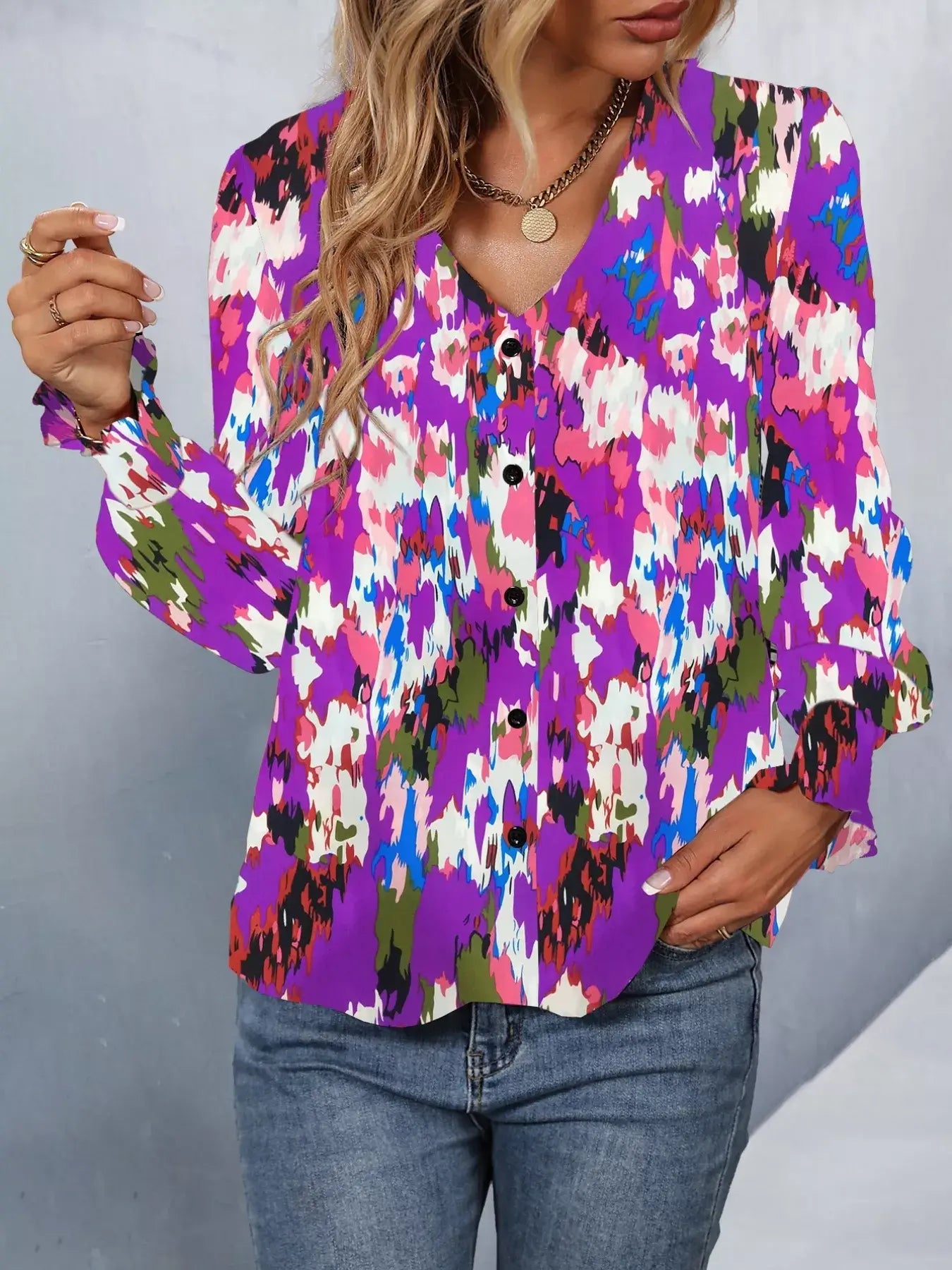 Printed button up long sleeve shirt in vibrant colors with buttoned front and long sleeves, perfect for versatile styling.