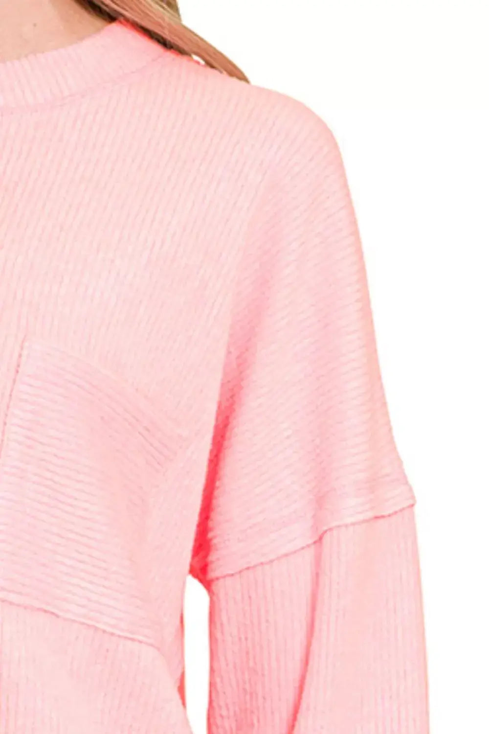 Zenana Ribbed Brushed Melange Hacci Sweater with Pocket in soft pink color, showcasing ribbed detailing and relaxed fit.