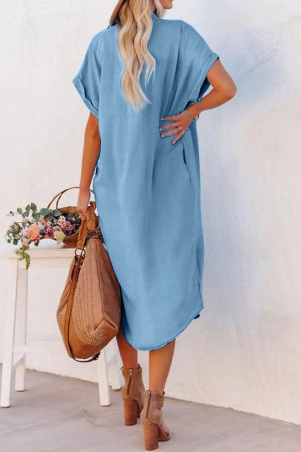 Slit Button Up Short Sleeve Imitation Denim Dress showcasing a model from the back, styled with a handbag and casual shoes.