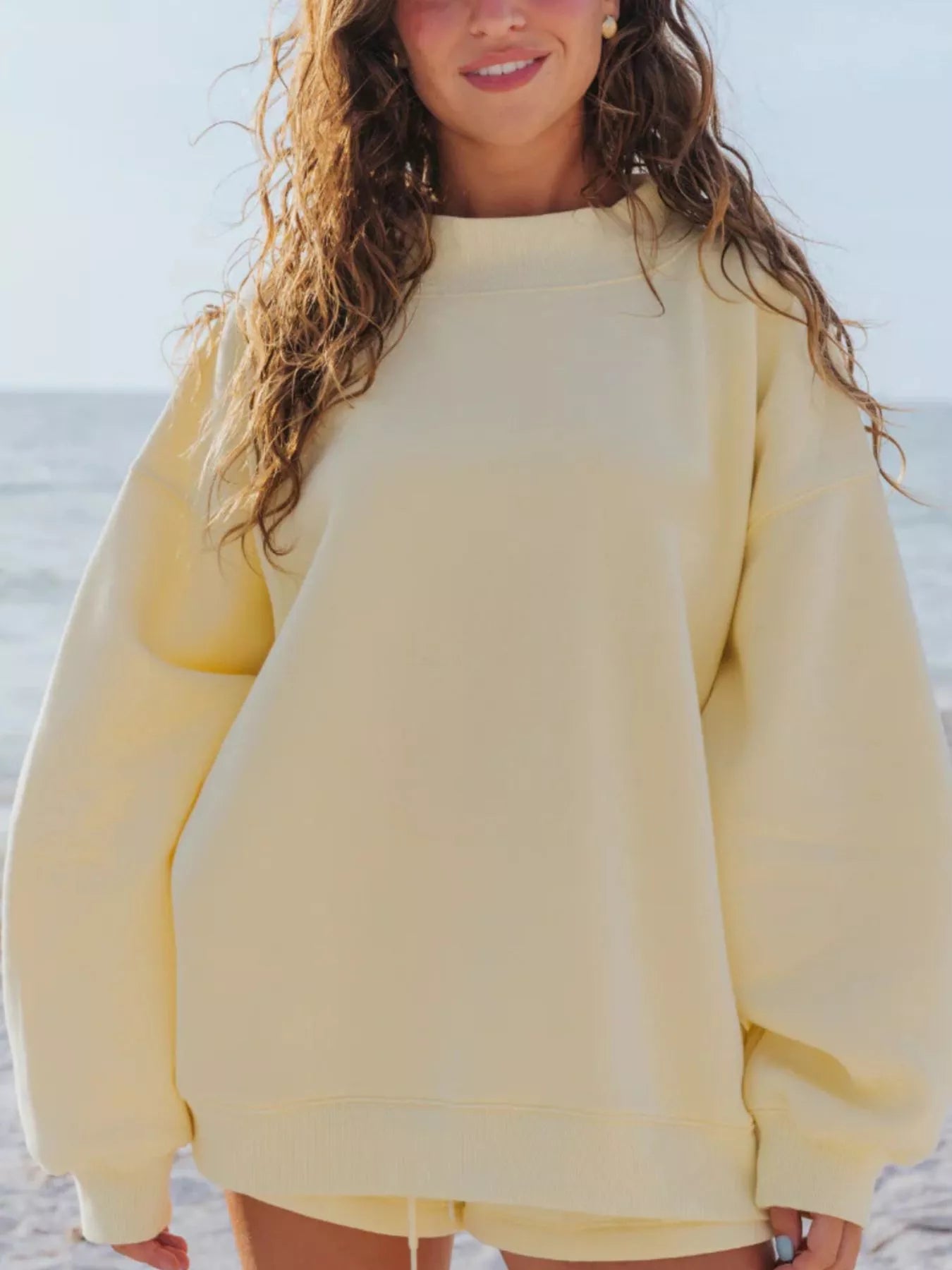 Relaxed Fit Round Neck Sweatshirt and Shorts Set in yellow, perfect for casual beach outings, featuring a relaxed design.