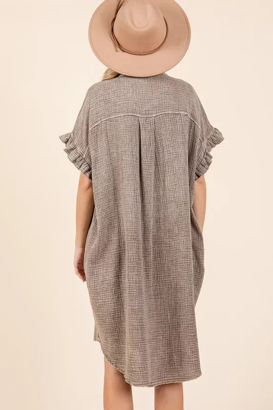 Back view of a woman wearing a Mineral Wash Cotton Gauze Mini Shirt Dress, featuring ruffle sleeves and a relaxed fit.