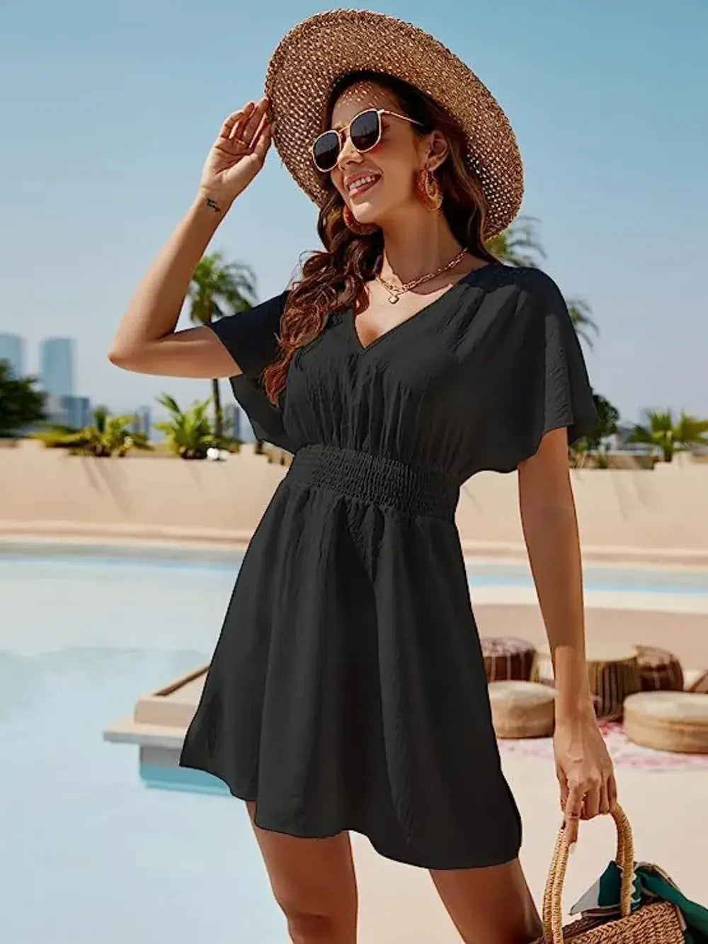 Smocked V-Neck Short Sleeve Dress: Casual elegance by the pool, featuring a flattering silhouette and stylish sun hat.