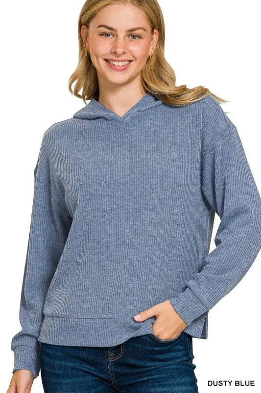 Model wearing Zenana Ribbed Long Sleeve Hoodie in dusty blue, showcasing ribbed texture and relaxed fit.