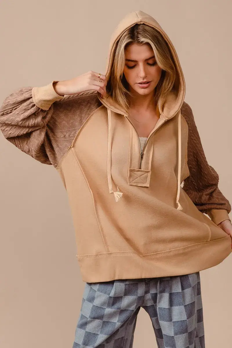 BiBi Half Zip French Terry Hoodie with Knit Sleeves worn by a model, showcasing its stylish design and comfort.