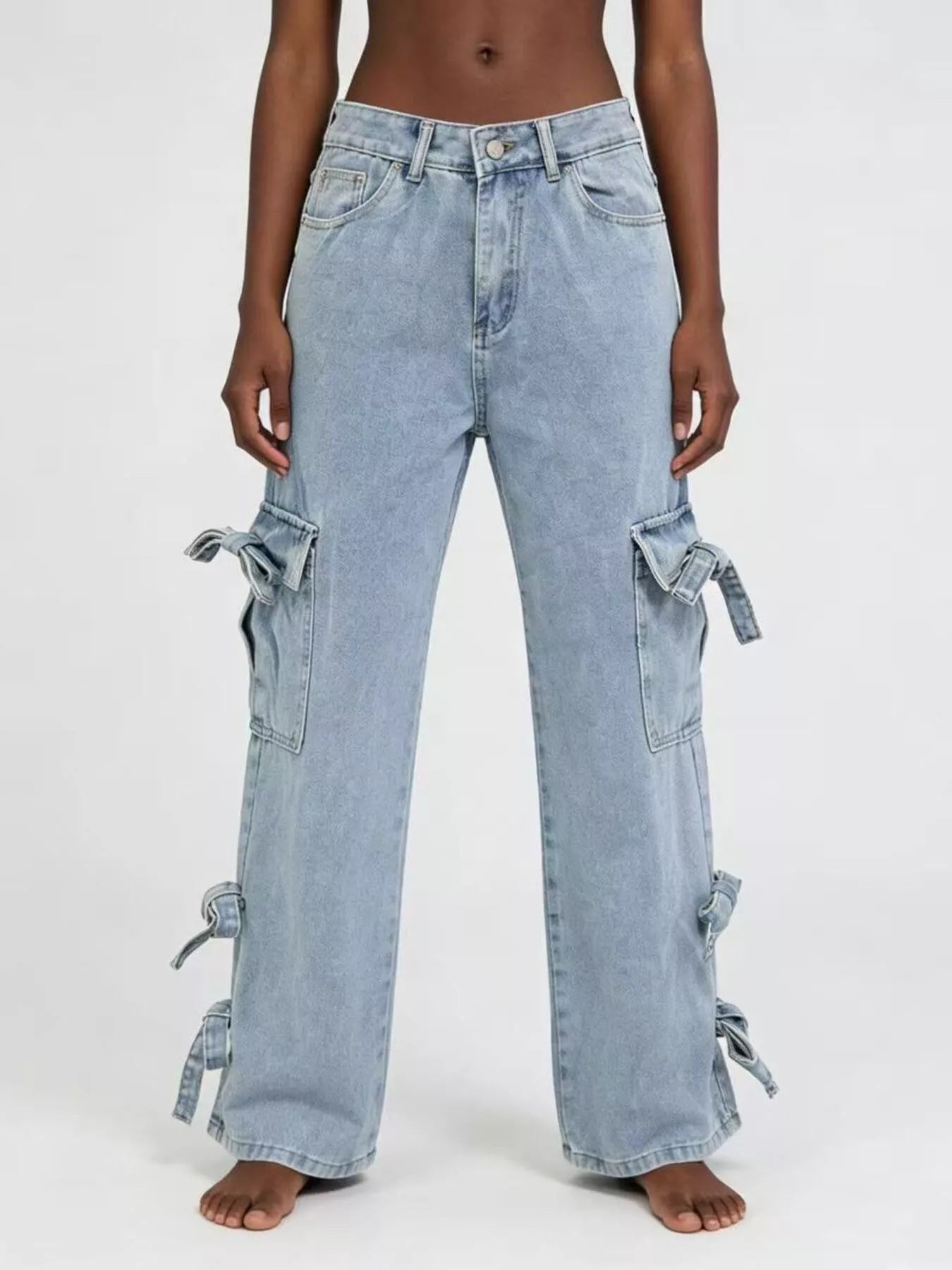 Model wearing Bow Wide Leg Jeans with pocketed detail and relaxed fit, showcasing stylish bows on the sides.
