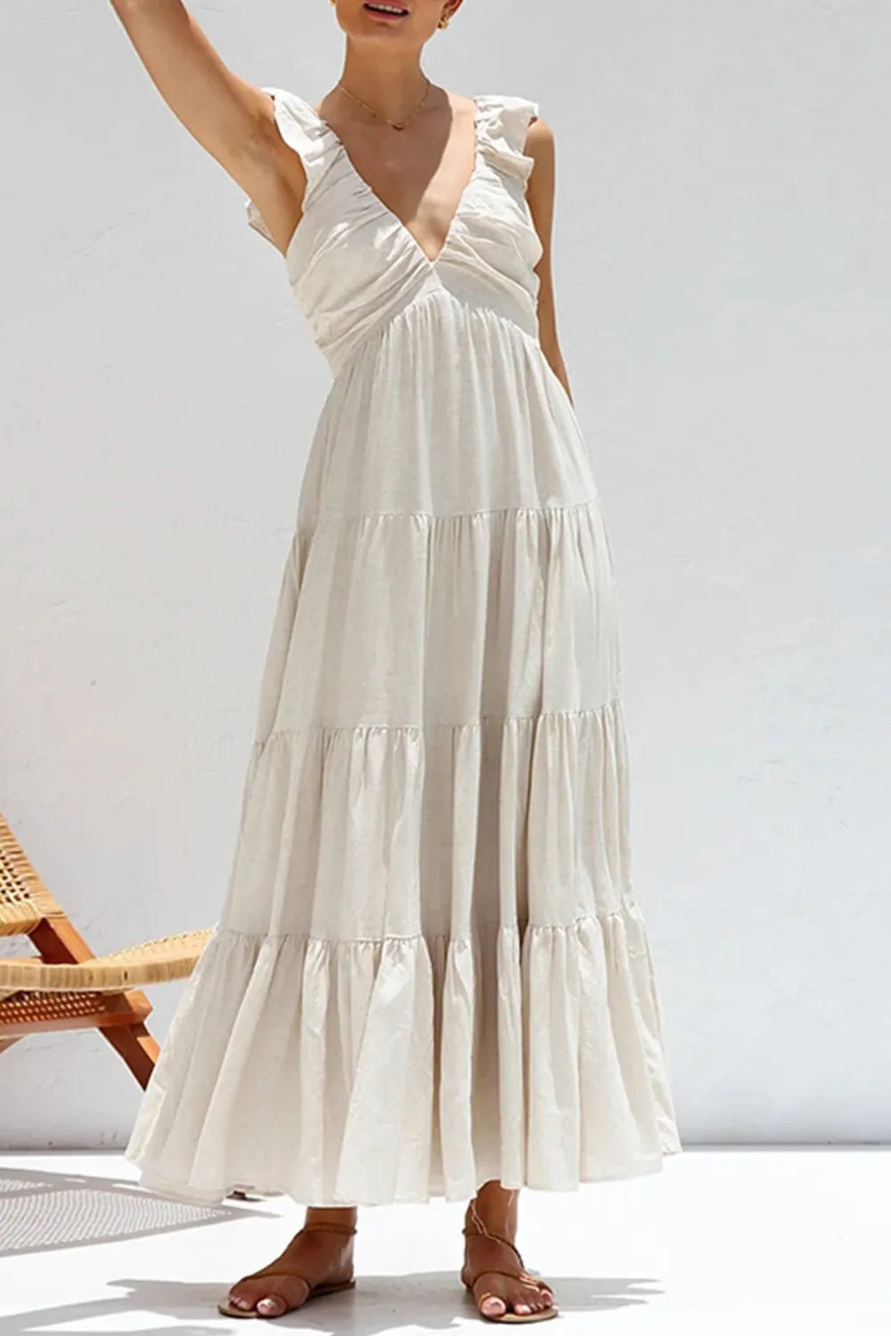 Ruffled V-Neck Tiered Dress in light beige, featuring smocked detailing and ruffled sleeves, perfect for summer occasions.