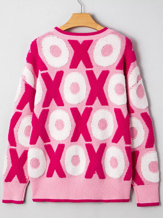 XOXO Pattern Round Neck Sweater back view showcasing vibrant pink and white design, perfect for cozy and cute style.