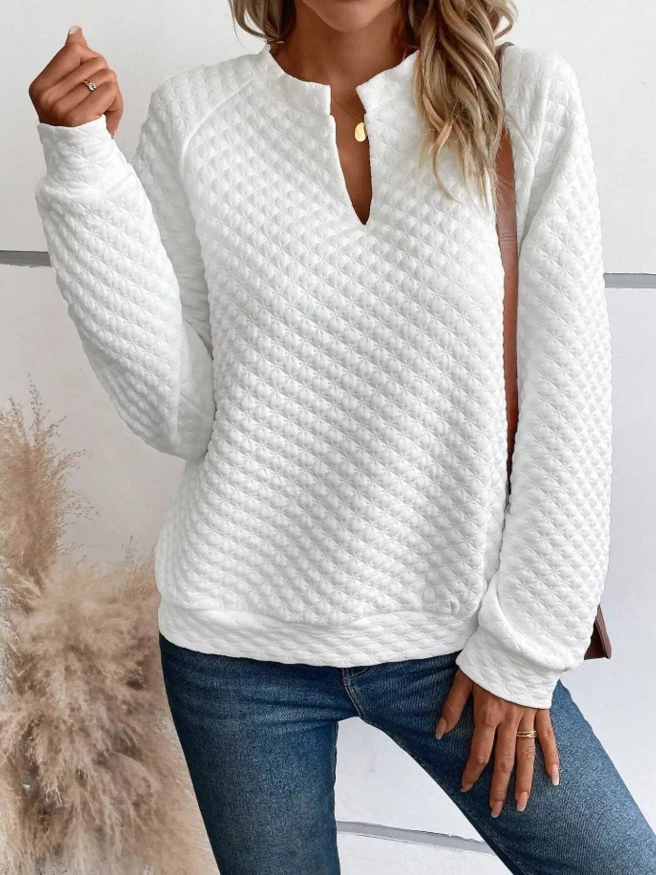Quilted Texture Long Sleeve Sweatshirt with Notched Neck in white worn by a woman, featuring a stylish design and front view.