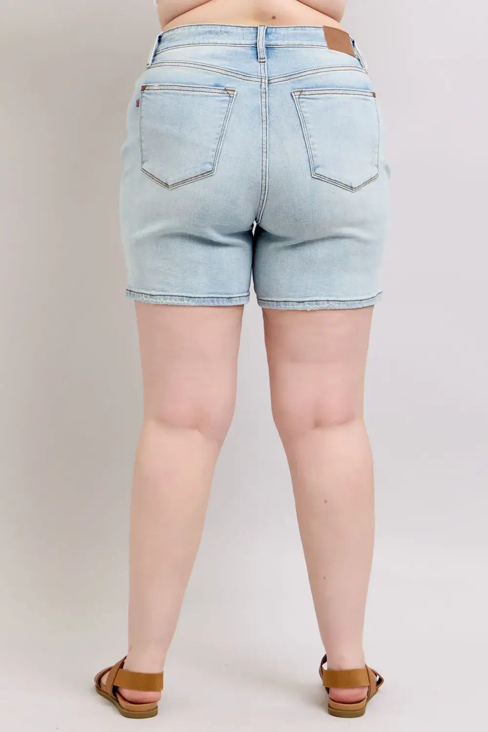 Back view of Judy Blue Plus Size Denim Shorts with pockets in light wash, perfect for casual summer outfits.