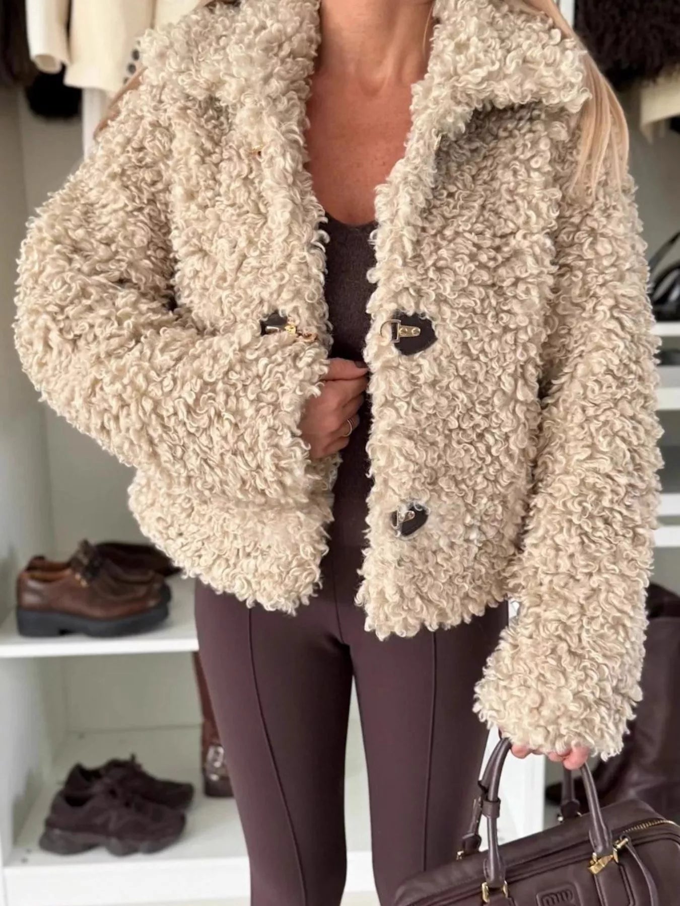 Sherpa Button-Down Outerwear in beige worn by a model, featuring a stylish fluffy texture for cozy layering.