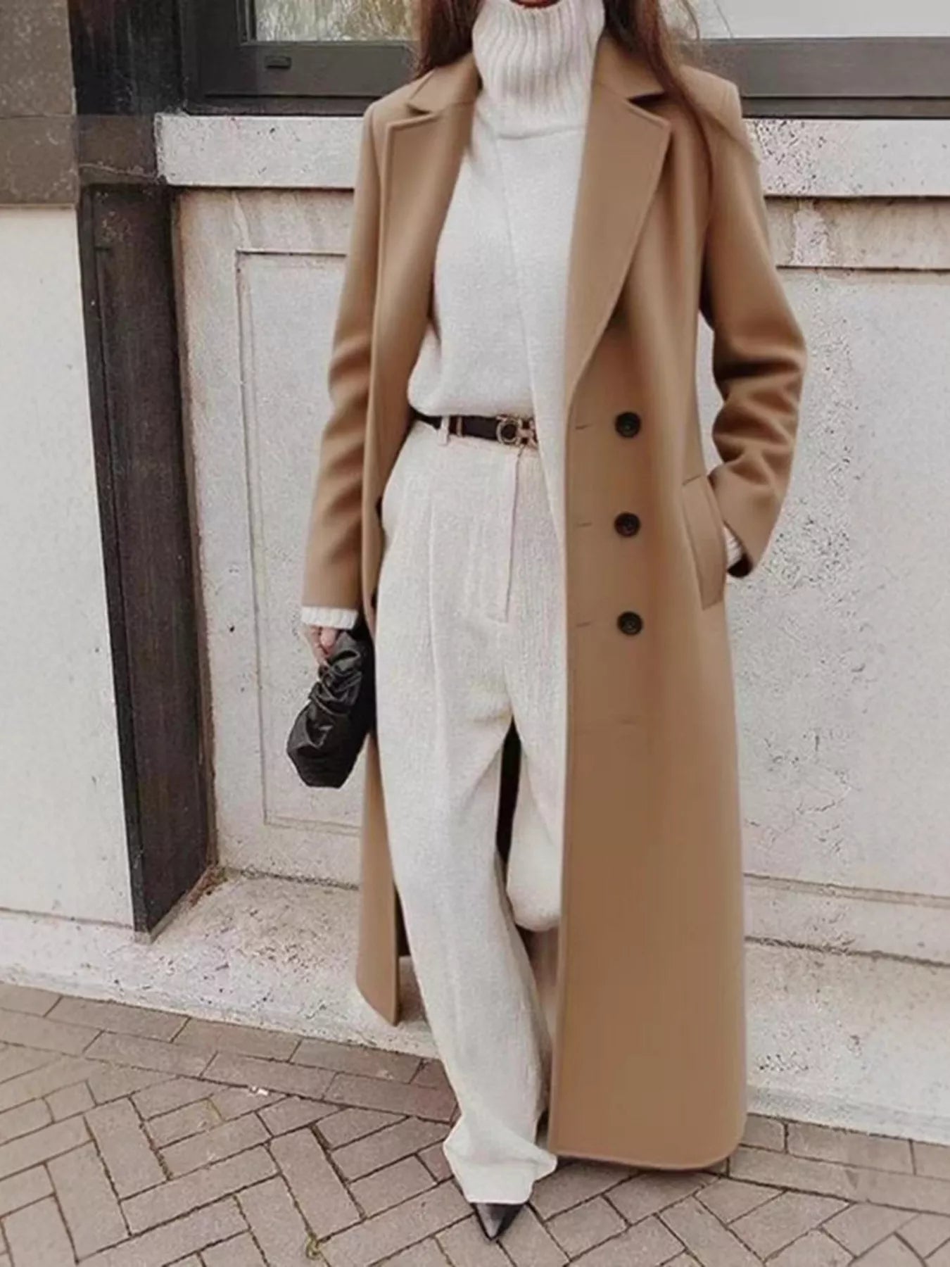 Double Breasted Longline Overcoat worn over a stylish beige turtleneck and wide-leg pants, ideal for elegance and comfort.
