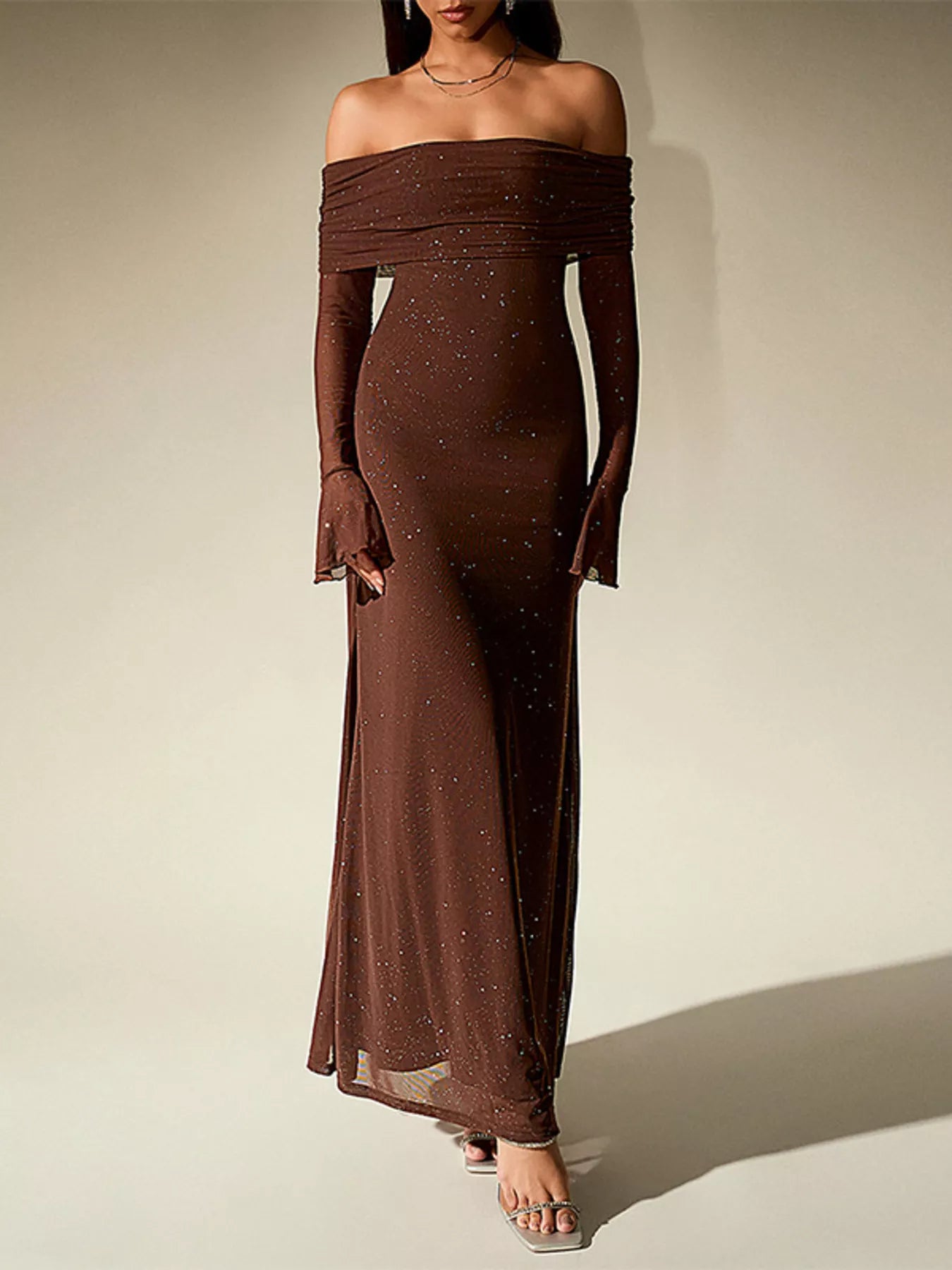 Glitter Off-Shoulder Maxi Dress in brown showcasing elegant design with flowy sleeves and shimmering details.
