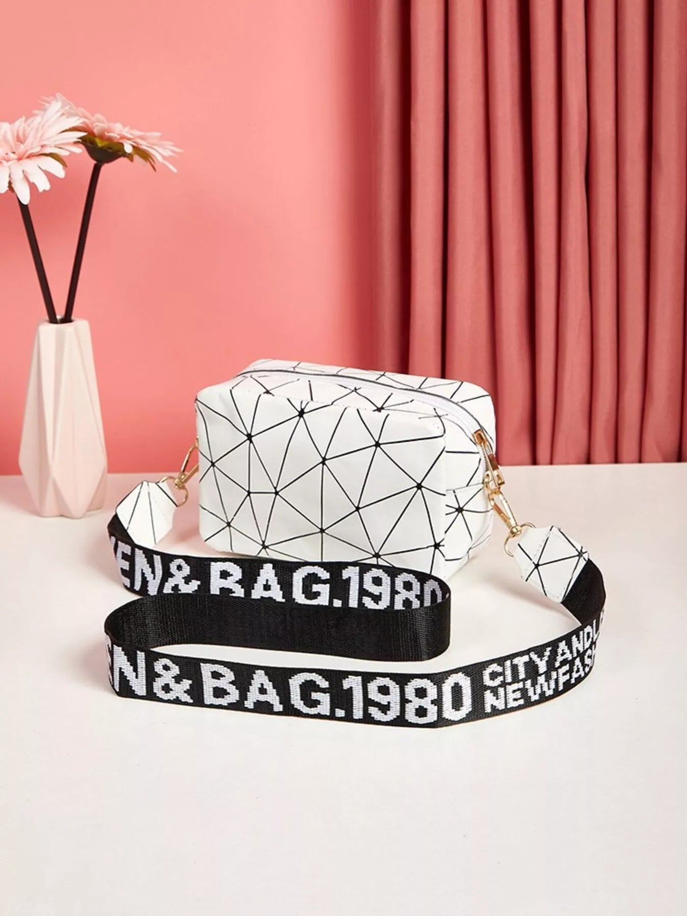 Geometric Pattern Crossbody Bag showcasing a stylish mini design with a unique print and adjustable strap.