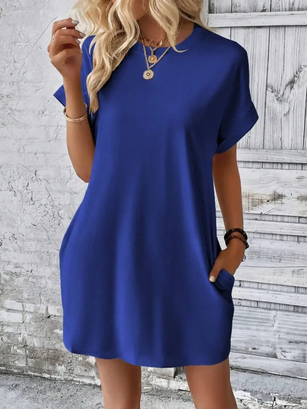 Pocketed round neck short sleeve dress in blue with casual fit and practical pockets, perfect for everyday comfort.