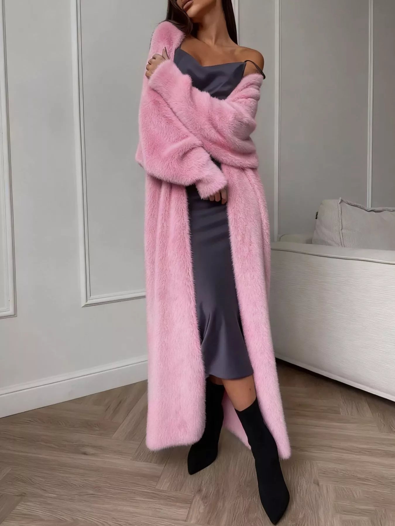 Fuzzy Open Front Longline Cardigan in pink worn over a silky dress, styled with black boots, perfect for cozy looks.