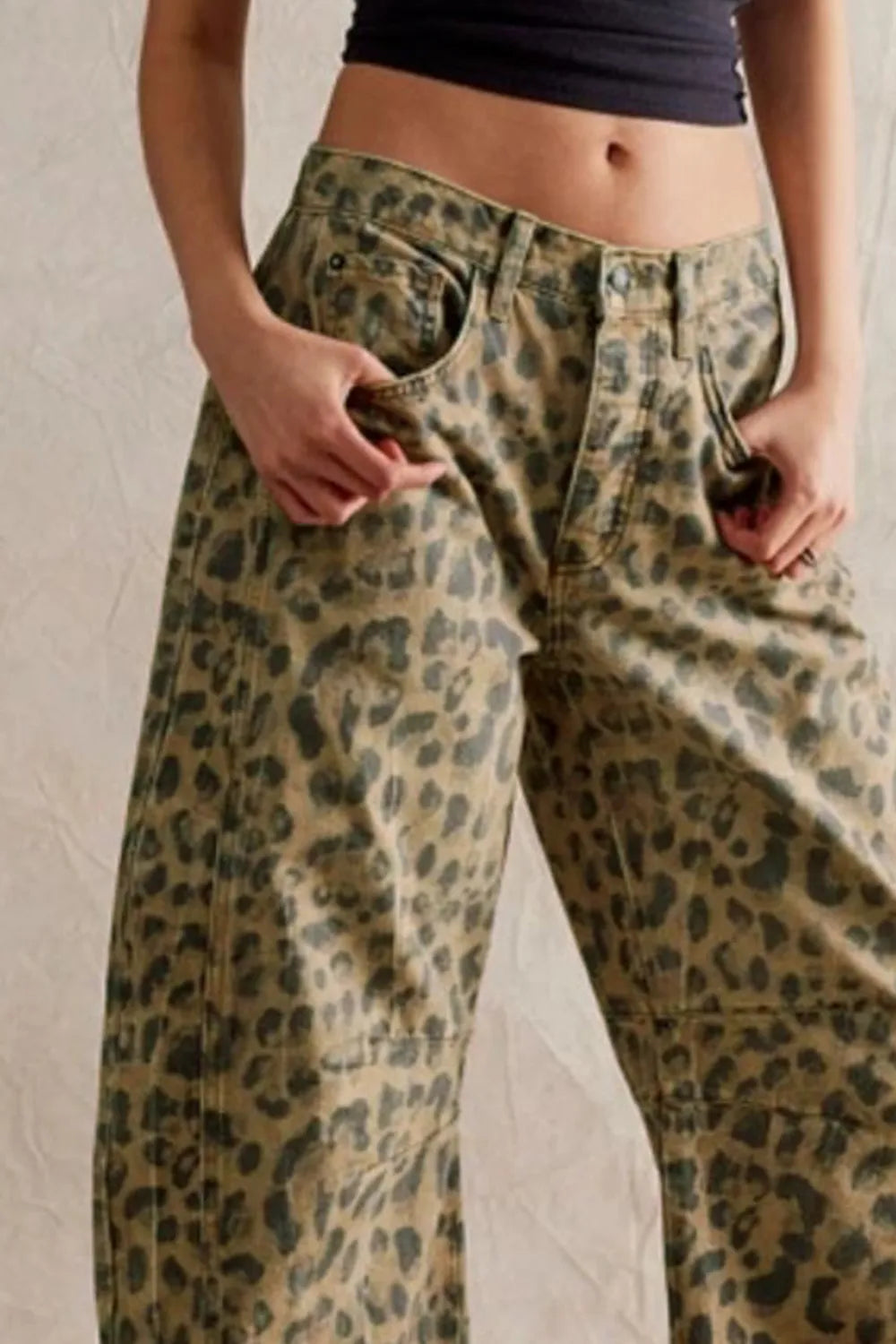Wide Leg Jeans with Pockets in leopard print for everyday casual style, highlighting buttoned pockets and relaxed fit.