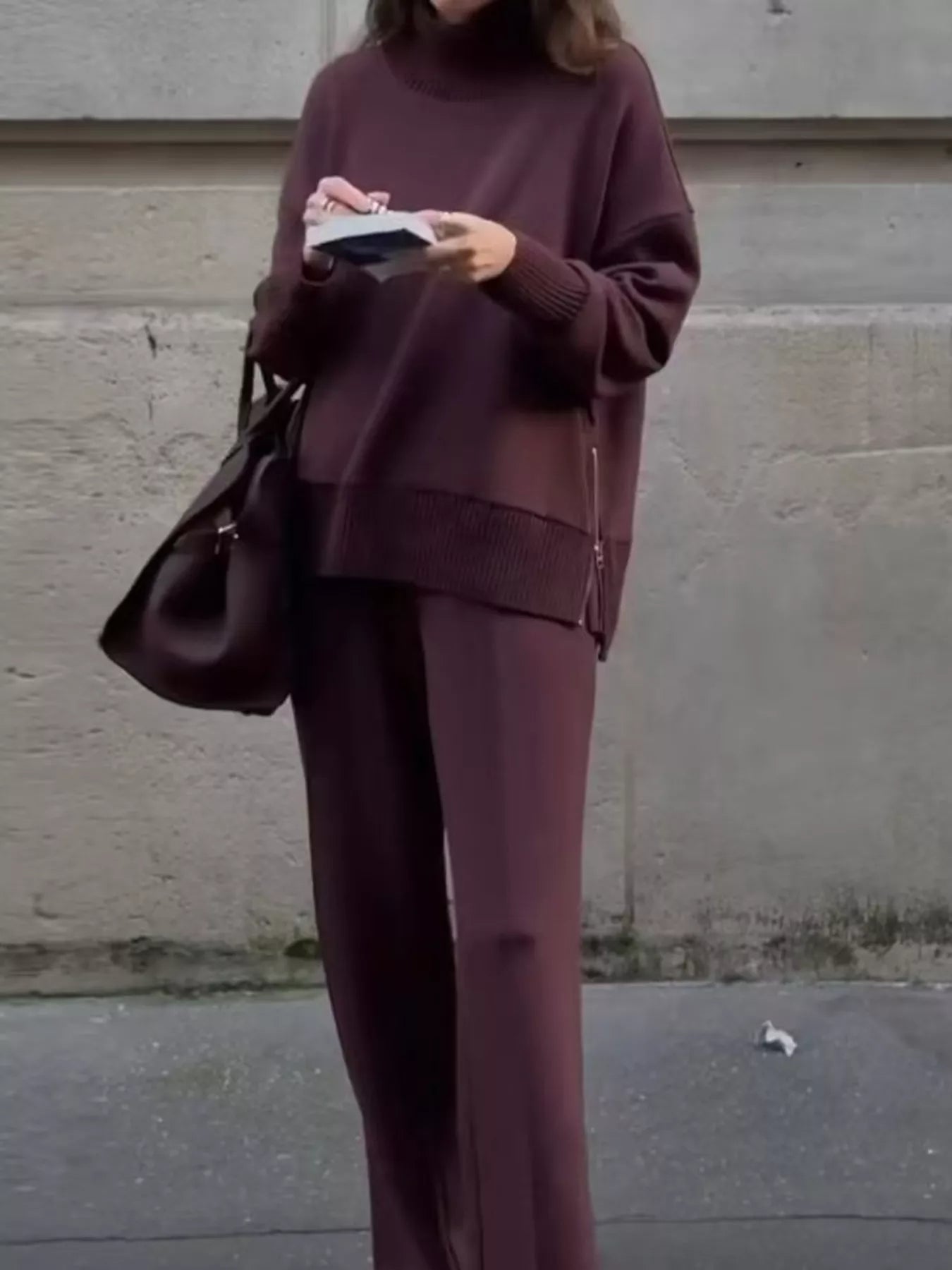 Woman wearing a Turtleneck Side Zipper Sweatshirt Pants Set in a stylish maroon color.