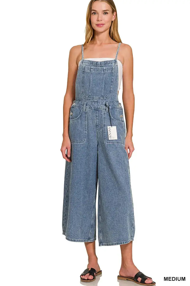 Woman wearing Zenana Denim Wide Leg Overalls in medium wash, styled with a casual top and sandals.